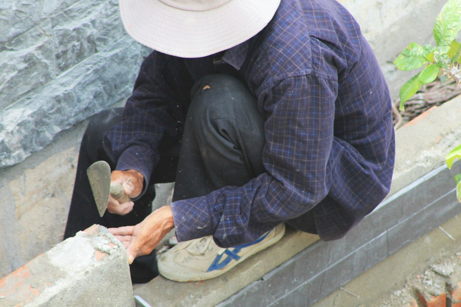 Mason laying chimney brickwork
