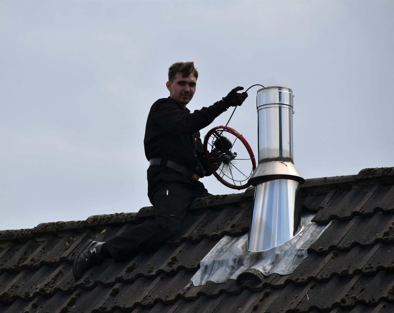 Chimney sweep brush inside a flue