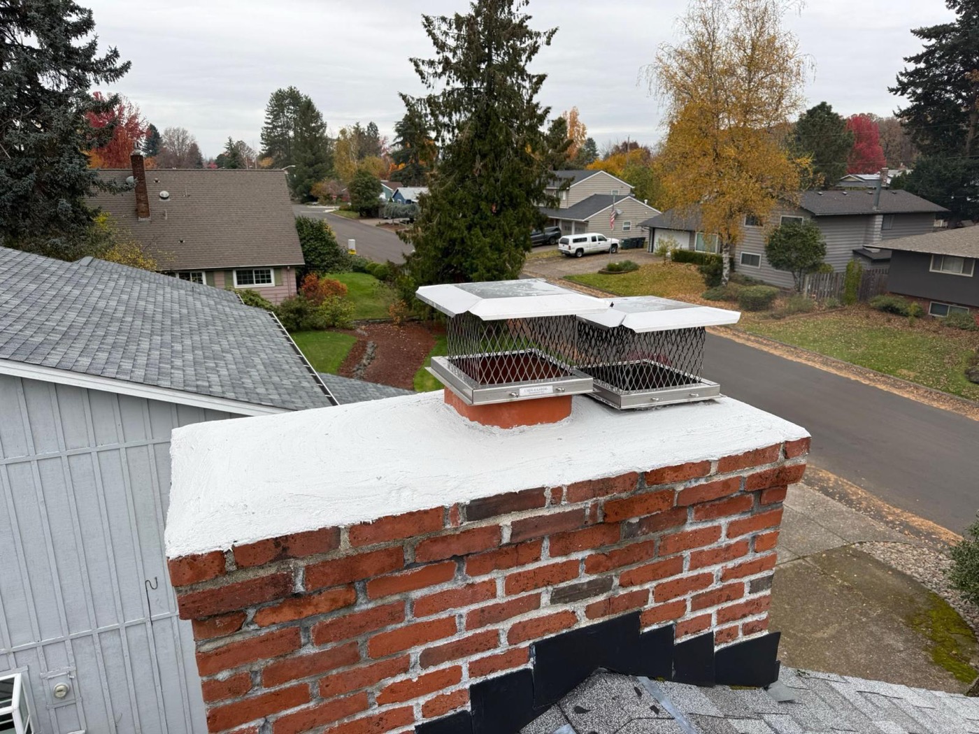 New chimney caps installed on a rebuilt crown